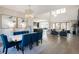 Open concept living space with modern furnishings, dining area, and abundant natural light at 6123 Chester Way, Denver, CO 80238