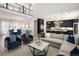 Elegant living space with open floor plan, modern kitchen, and comfortable seating area at 6123 Chester Way, Denver, CO 80238