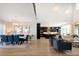 Spacious open-concept living space with modern kitchen, dining and living areas at 6123 Chester Way, Denver, CO 80238