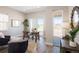 Bright home office featuring a wooden desk, large windows, and elegant decor, perfect for a productive workspace at 6123 Chester Way, Denver, CO 80238