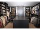 Well-organized walk-in closet with custom shelving and ample storage space for clothing and accessories, maximizing organization at 6123 Chester Way, Denver, CO 80238