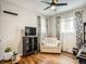 Cozy bedroom with hardwood floors, a comfortable sofa, and ample natural light from the windows at 6346 Fenton St, Arvada, CO 80003