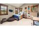 A colorful bedroom with unique décor, comfortable bed, and natural light at 168 Corkscrew Dr, Breckenridge, CO 80424