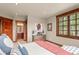 Bright bedroom has an en suite bath and a beautiful view through a large window at 168 Corkscrew Dr, Breckenridge, CO 80424