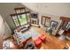 Open living room with fireplace and a wall of windows with beautiful views and natural light at 168 Corkscrew Dr, Breckenridge, CO 80424
