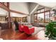 Bright living room with large windows, hardwood floors, and cozy furniture at 168 Corkscrew Dr, Breckenridge, CO 80424