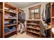 Custom walk-in closet with wooden shelving and plenty of storage space at 168 Corkscrew Dr, Breckenridge, CO 80424