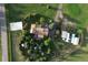 Overhead view of house, gardens, and outbuildings on a spacious lot at 12768 Grizzly Dr, Littleton, CO 80127