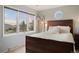 Bedroom with mountain views and a queen-size bed at 12768 Grizzly Dr, Littleton, CO 80127