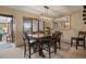 Formal dining room with wood table and chairs and access to the patio at 12768 Grizzly Dr, Littleton, CO 80127