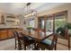 Bright dining room with large windows and elegant wood table at 12768 Grizzly Dr, Littleton, CO 80127