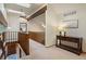 Upstairs hallway with skylights and wooden railing overlooking the entry at 12768 Grizzly Dr, Littleton, CO 80127