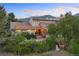 Two story home with a stone patio and mountain views at 12768 Grizzly Dr, Littleton, CO 80127