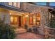 Stone house exterior with inviting entryway and landscaping at 12768 Grizzly Dr, Littleton, CO 80127