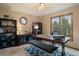 Home office with built-in shelving and a large work desk at 12768 Grizzly Dr, Littleton, CO 80127