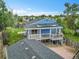 Aerial view of home with solar panels, covered deck, and large backyard at 1922 Danube Way, Aurora, CO 80011