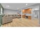 Finished basement with recessed lighting, wood floors and cabinetry at 1922 Danube Way, Aurora, CO 80011