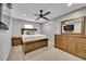 A bedroom with a queen size bed, ceiling fan and hardwood furniture at 1922 Danube Way, Aurora, CO 80011