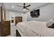 Bedroom with ceiling fan, tv, and chest of drawers at 1922 Danube Way, Aurora, CO 80011