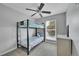A childs bedroom with bunkbeds, window and dresser at 1922 Danube Way, Aurora, CO 80011