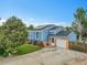 Charming home showcasing well-maintained front yard, solar panels, and attached garage at 1922 Danube Way, Aurora, CO 80011