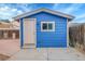 Outbuilding painted blue with a white door at 1922 Danube Way, Aurora, CO 80011
