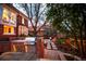 Backyard features an outdoor kitchen with stainless steel grill and a stone pathway leading to other outdoor living spaces at 963 N Lafayette St, Denver, CO 80218