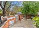 Backyard patio area features an outdoor kitchen with built-in grill, stainless steel drawers, and ample counter space at 963 N Lafayette St, Denver, CO 80218