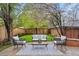 Outdoor patio with seating, stylish decor, a manicured lawn, lush trees and garden, providing a relaxing atmosphere at 963 N Lafayette St, Denver, CO 80218