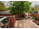 Cozy backyard patio with a built-in grill, seating area, and string lights, ideal for relaxing and entertaining outdoors at 963 N Lafayette St, Denver, CO 80218