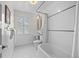 Classic bathroom with vintage-style tile, a soaking tub, and a bright window at 963 N Lafayette St, Denver, CO 80218