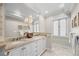 Bathroom featuring double sinks, a large mirror, and a vanity with marble countertops at 963 N Lafayette St, Denver, CO 80218