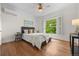 Inviting bedroom featuring a plush bed, bright windows, and stylish décor at 963 N Lafayette St, Denver, CO 80218