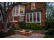 Beautiful brick house with a cozy fire pit area and manicured landscaping, perfect for outdoor entertaining at 963 N Lafayette St, Denver, CO 80218
