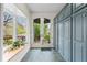 Hallway featuring tile flooring, large bay window, and custom storage cabinets at 963 N Lafayette St, Denver, CO 80218