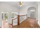 Hallway features hardwood floors, decorative molding, staircase, and an abundance of natural light at 963 N Lafayette St, Denver, CO 80218