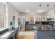 Spacious kitchen with stainless steel appliances, granite countertops, and ample counter space at 963 N Lafayette St, Denver, CO 80218