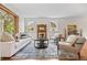Cozy living room featuring stylish furniture, decorative fireplace, and natural light at 963 N Lafayette St, Denver, CO 80218