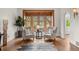 Sunlit sitting room with beautiful wood-trimmed windows and hardwood floors at 963 N Lafayette St, Denver, CO 80218