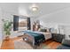 Cozy bedroom featuring natural light and warm hardwood floors at 816 Forest St, Denver, CO 80220