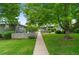 Serene community with lush greenery and inviting walkways connecting charming homes at 816 Forest St, Denver, CO 80220