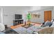 Bright living room with hardwood floors, perfect for relaxation and entertaining at 816 Forest St, Denver, CO 80220