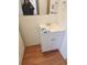 Modest bathroom featuring a vanity with sink and wood flooring at 1304 S Parker Rd # 359, Denver, CO 80231