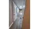 Hallway leading to the bathroom featuring neutral colors and two doors, one to the linen closet at 1304 S Parker Rd # 359, Denver, CO 80231