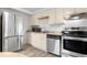 Bright, updated kitchen features stainless steel appliances and light wood cabinets at 1304 S Parker Rd # 359, Denver, CO 80231