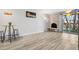 Open living room with fireplace and sliding door to the outside balcony at 1304 S Parker Rd # 359, Denver, CO 80231