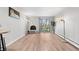 Open living room with fireplace and sliding glass doors out to balcony at 1304 S Parker Rd # 359, Denver, CO 80231