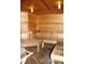 View of a well-maintained wood sauna room with wood benches, and a wood slat ceiling with lighting at 1304 S Parker Rd # 359, Denver, CO 80231