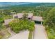 Expansive home with a red tile roof, nestled among trees with mountain views at 857 Pawnee Trl, Castle Rock, CO 80108
