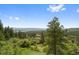 A view of the trees and mountains from the property at 857 Pawnee Trl, Castle Rock, CO 80108
